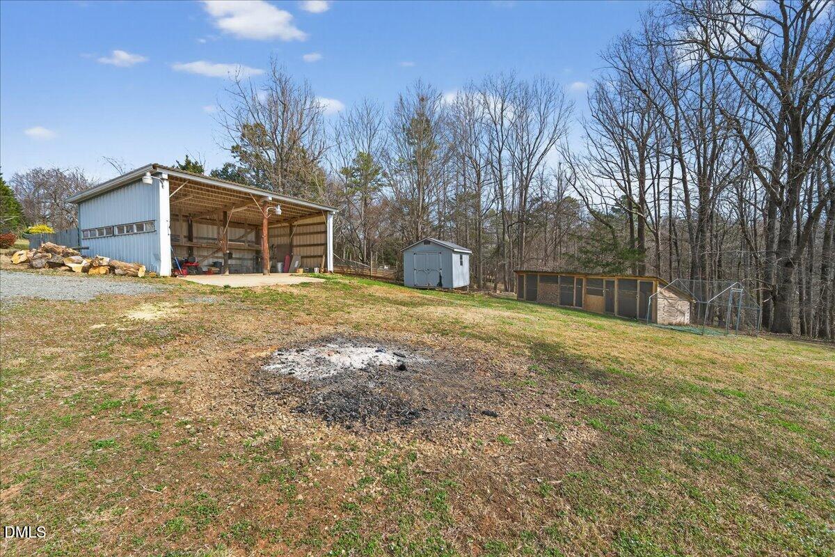 180 Manor Drive Timberlake, NC 27583 - Photo 64 of 85 a view of a house with a yard