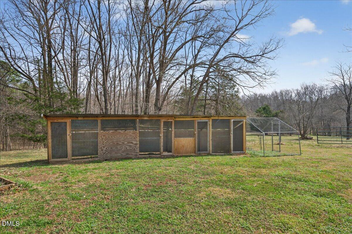 180 Manor Drive Timberlake, NC 27583 - Photo 66 of 85 a front view of house with yard and trees