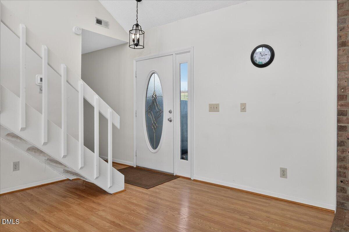 180 Manor Drive Timberlake, NC 27583 - Photo 6 of 85 a view of a door with wooden floor