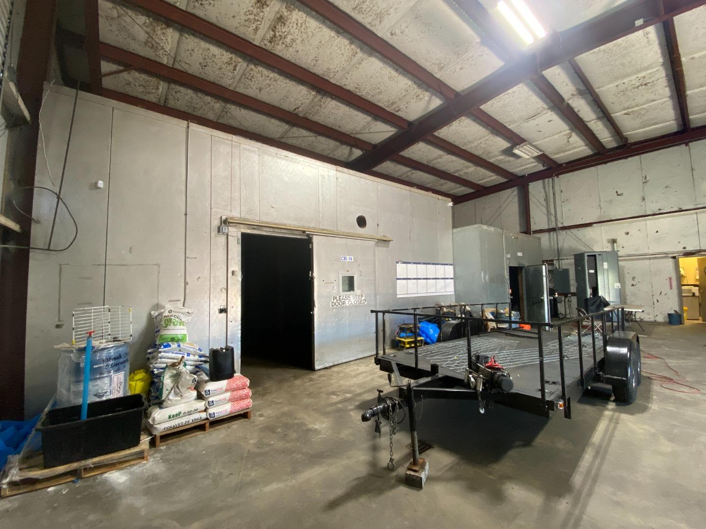 189 Hughes Road Watsonville, CA 95076 - Photo 11 of 35 a living room with lots of furniture and a chandelier