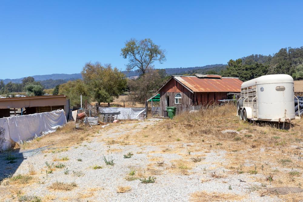 189 Hughes Road Watsonville, CA 95076 - Photo 22 of 35 a view of a backyard with a table and chairs