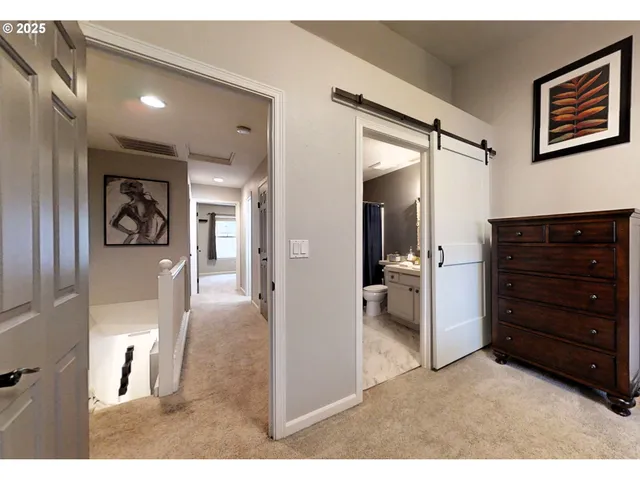 a open area with a bench and a clock