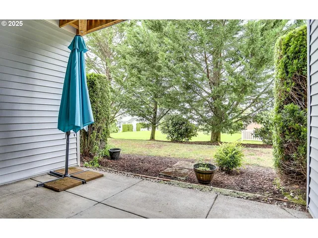 a view of swimming pool with outdoor seating and plants