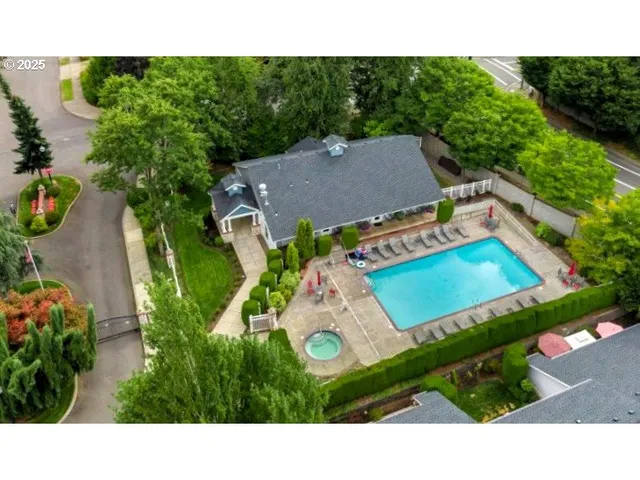 a view of a house with pool and chairs