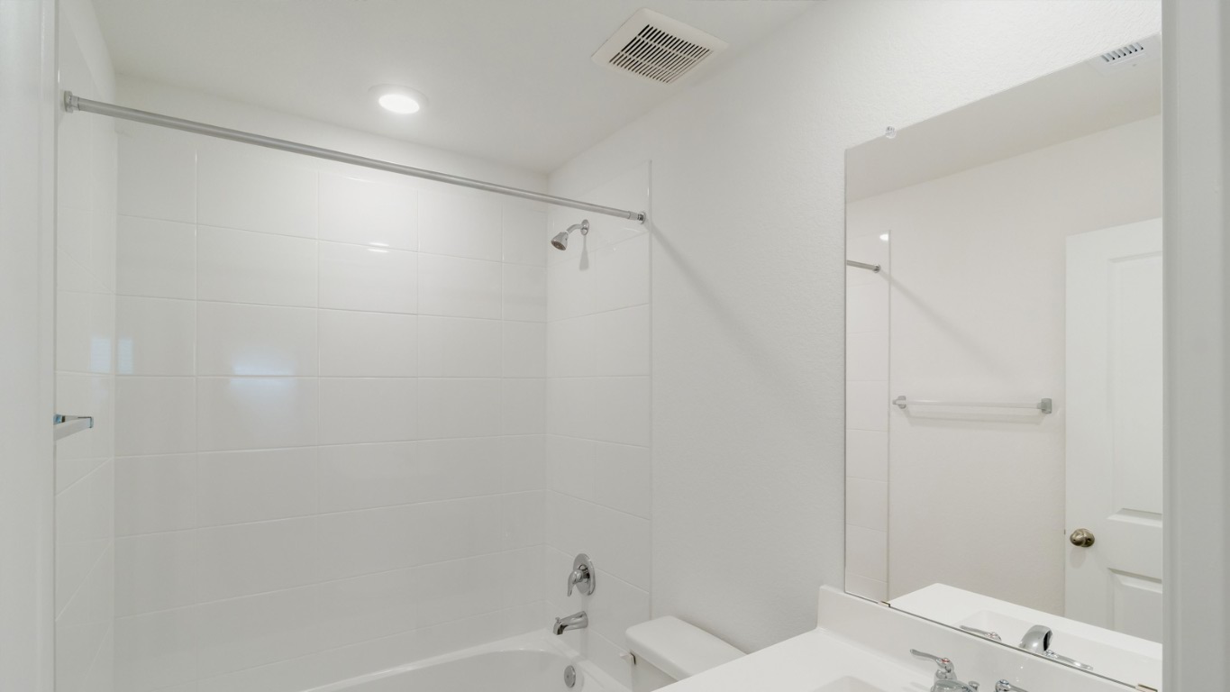 345 Bull Lake Circle Buda, TX 78610 - Photo 16 of 17 a bathroom with a shower and a toilet