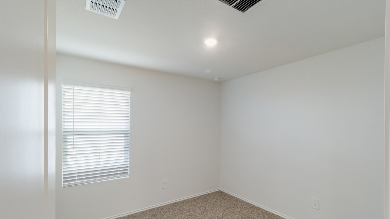 345 Bull Lake Circle Buda, TX 78610 - Photo 17 of 17 a view of an empty room with a window