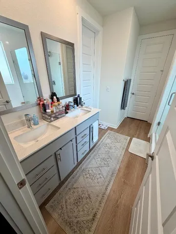 a bedroom with a large bed and a couch