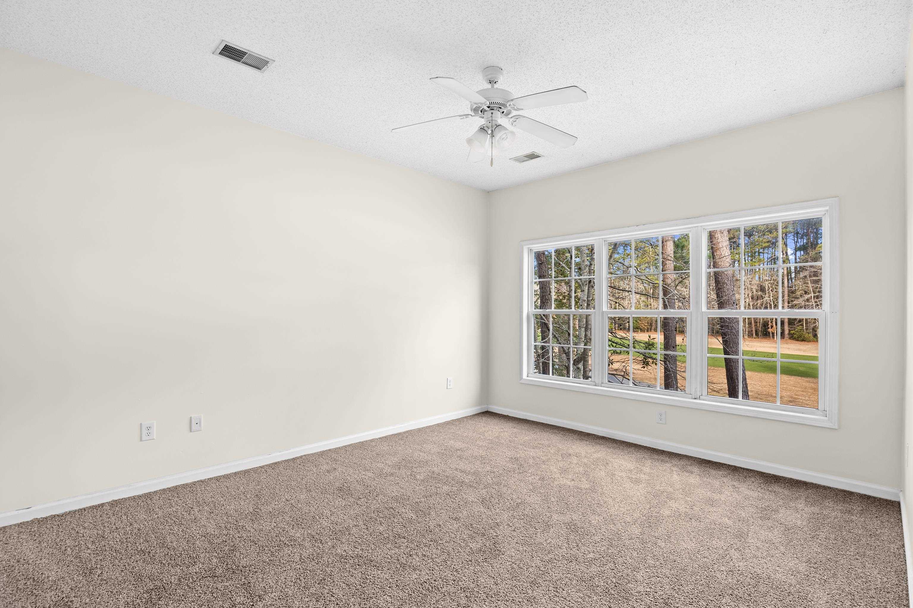 5846 Longwood Drive, Unit 203 Murrells Inlet, SC 29576 - Photo 13 of 38 New carpet, walk-in closet, ceiling fan with a light. Nice view of the golf course.