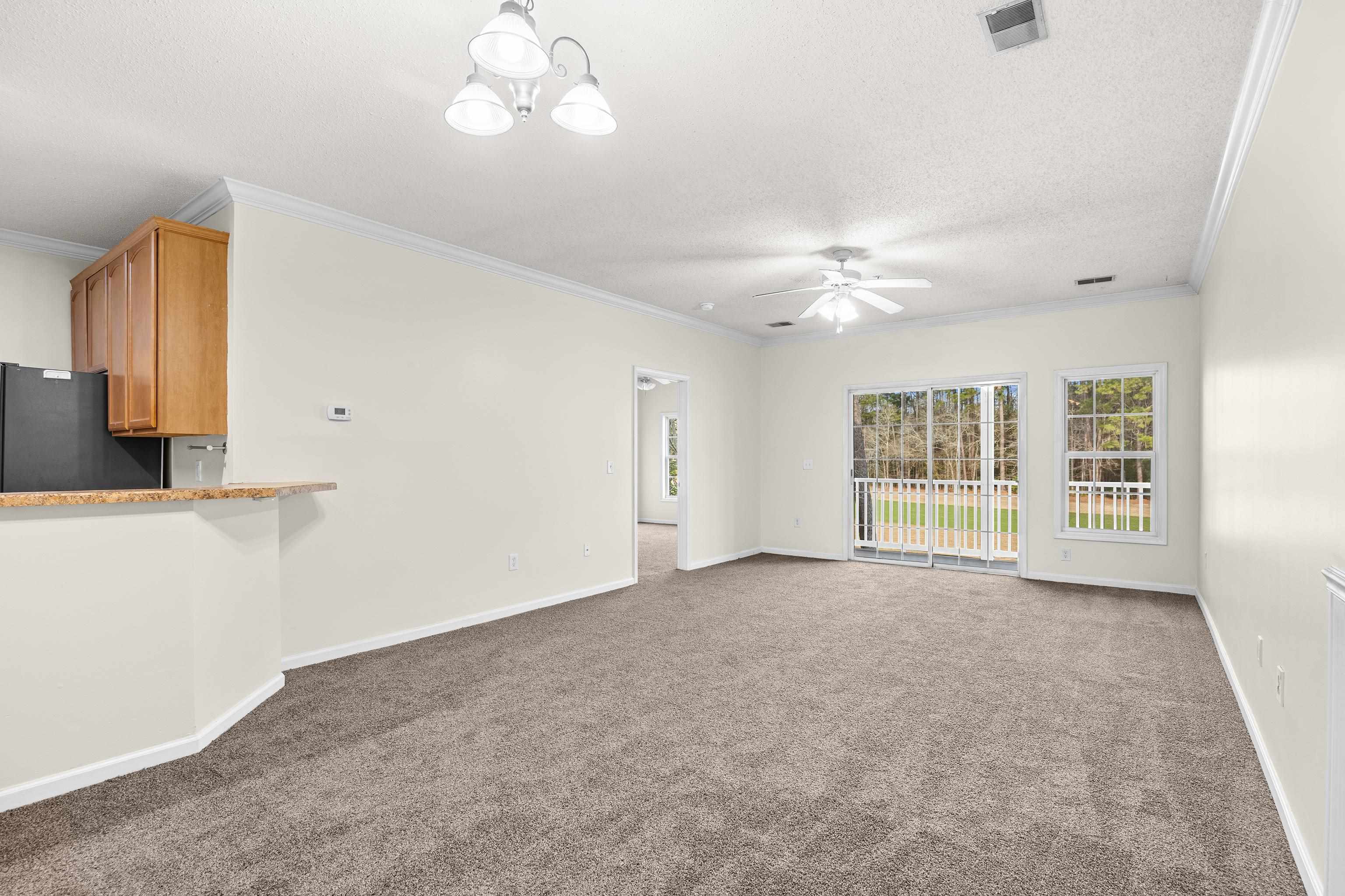 5846 Longwood Drive, Unit 203 Murrells Inlet, SC 29576 - Photo 25 of 38 A large sliding door opens to the screened-in porch, with a beautiful golf course view.