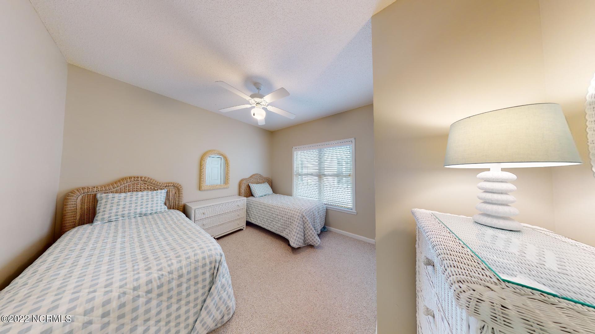409 27th Street, Unit A Sunset Beach, NC 28468 - Photo 12 of 37 Second Bedroom