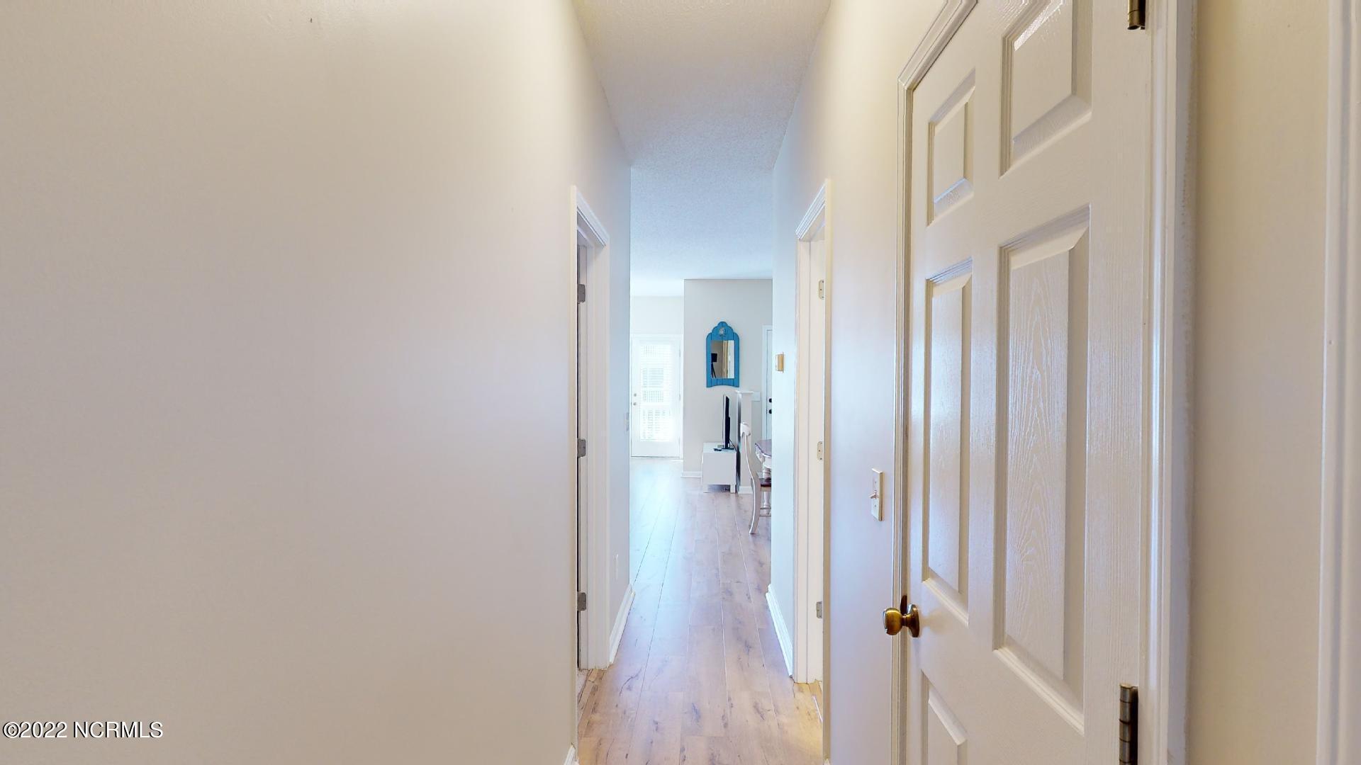 409 27th Street, Unit A Sunset Beach, NC 28468 - Photo 14 of 37 Hall Laundry Closet