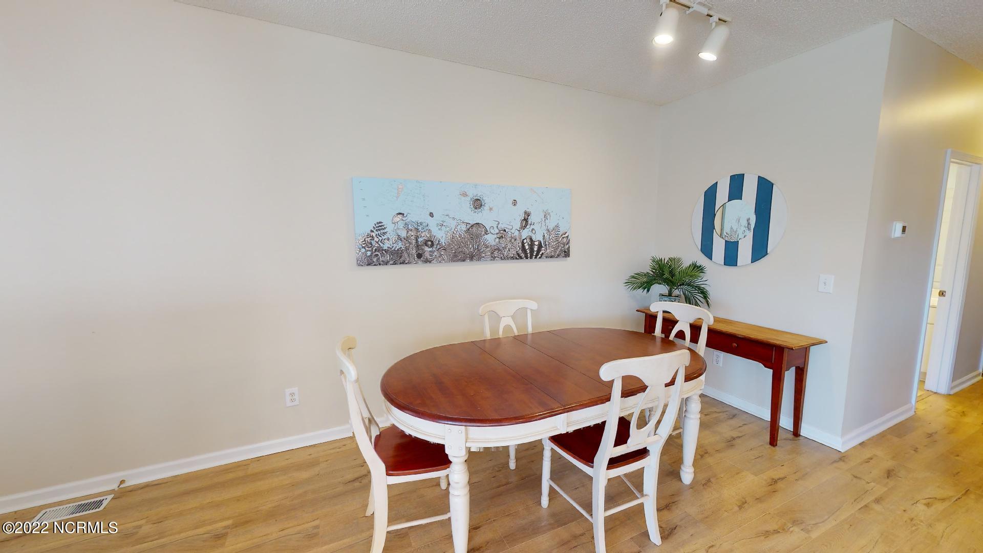409 27th Street, Unit A Sunset Beach, NC 28468 - Photo 7 of 37 Dining Room