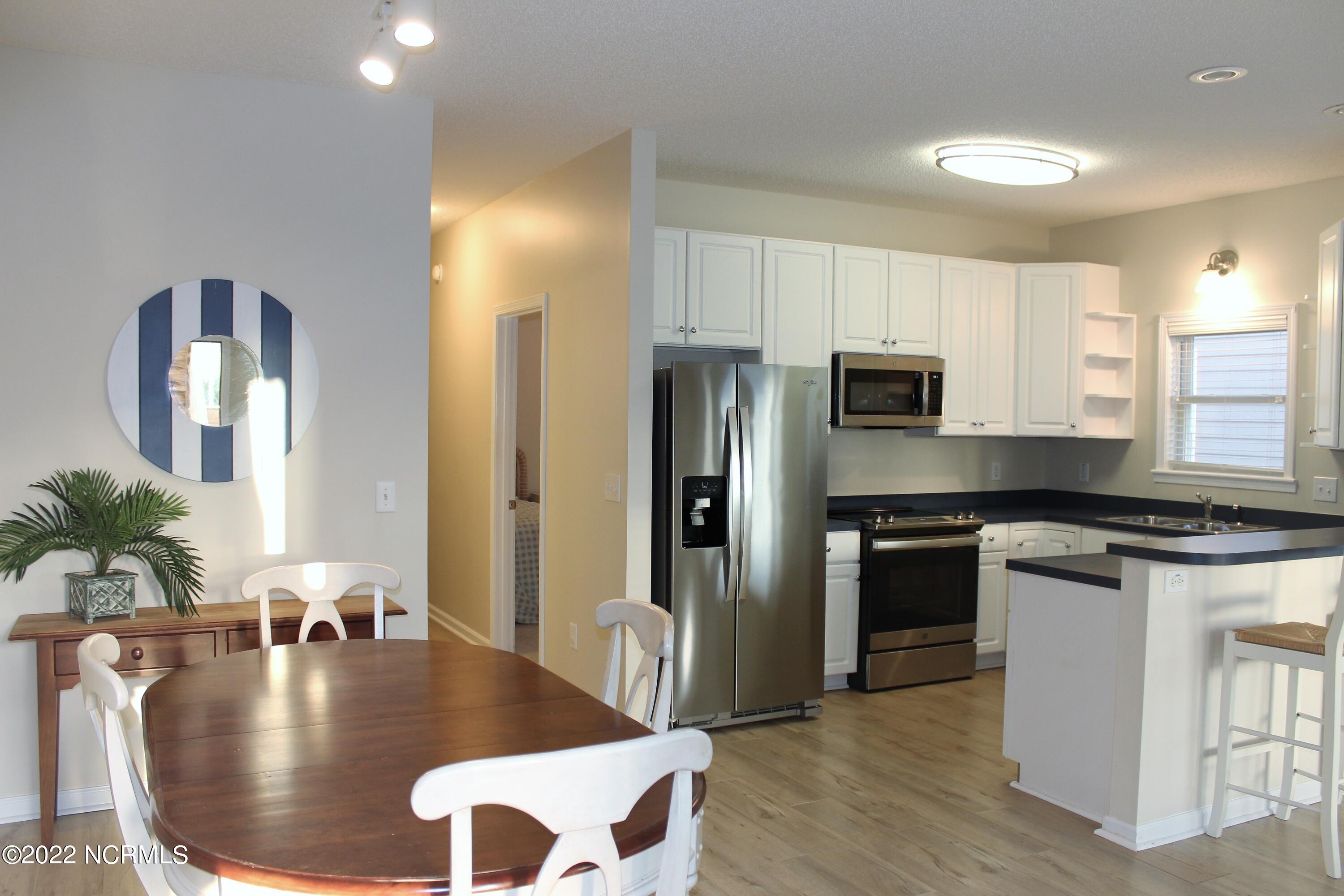 409 27th Street, Unit A Sunset Beach, NC 28468 - Photo 8 of 37 Dining and Kitchen