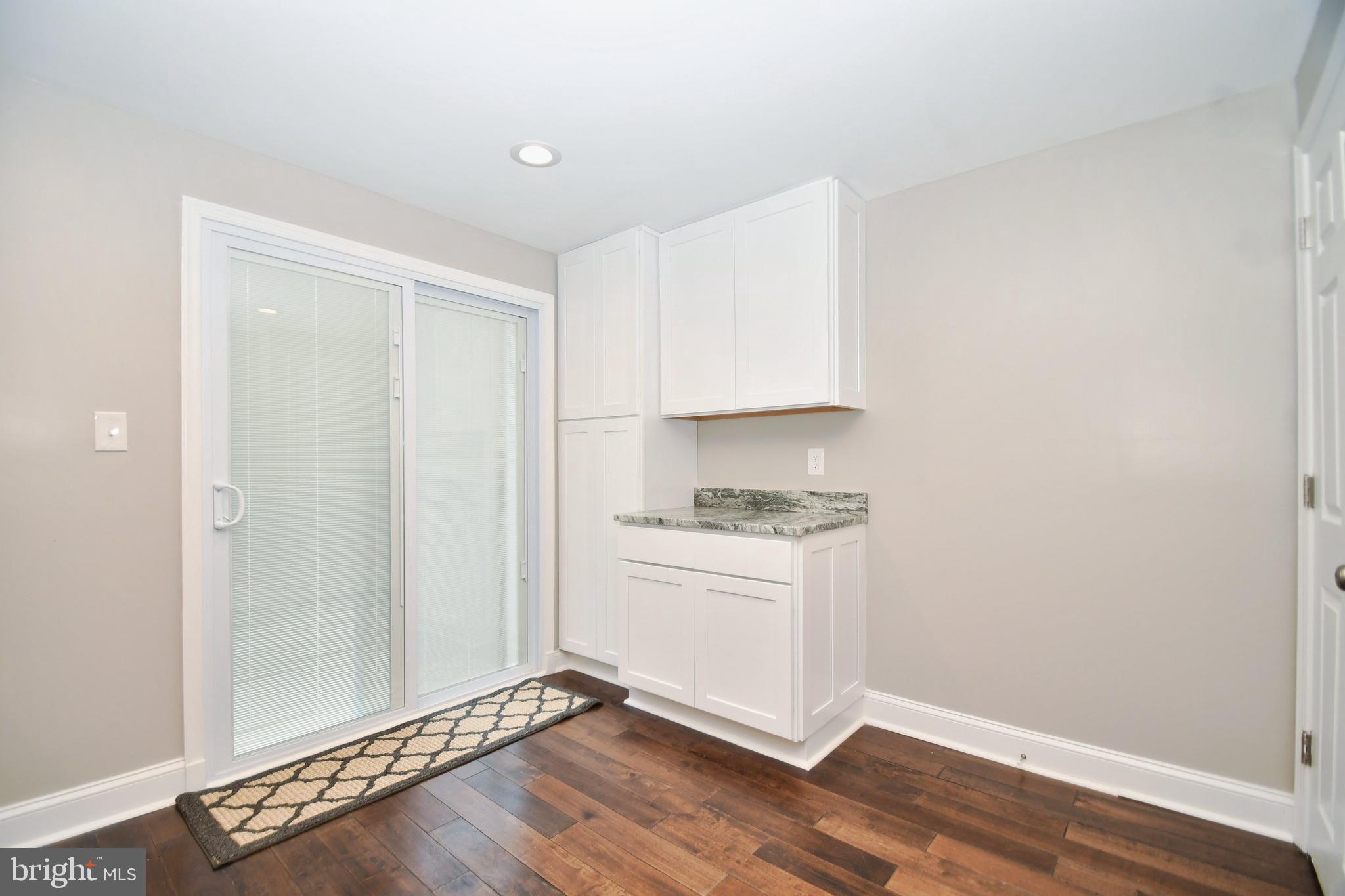 4817 Variation Road Baltimore, MD 21236 - Photo 15 of 42 New sliders to deck. Pantry and extra table space!