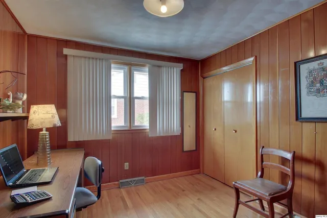 a workspace with furniture and a window