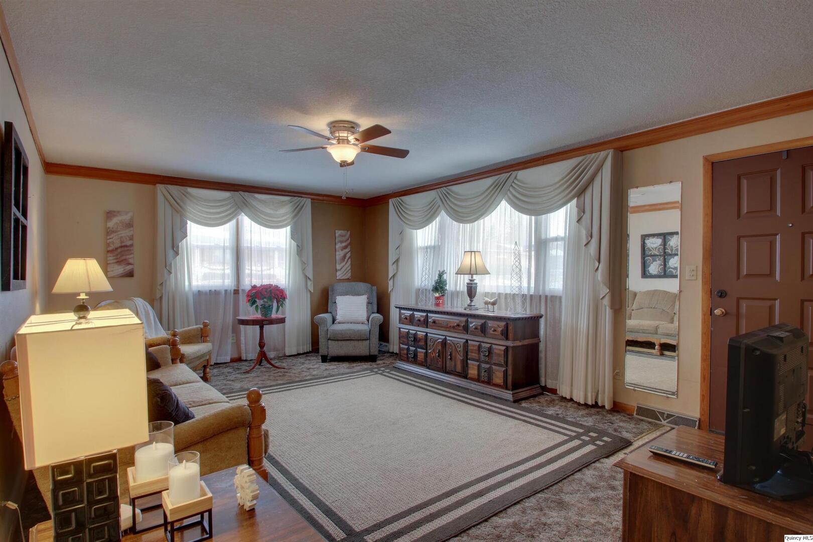 523 Temple Street Quincy, IL 62305 - Photo 5 of 23 a bedroom with furniture and a window