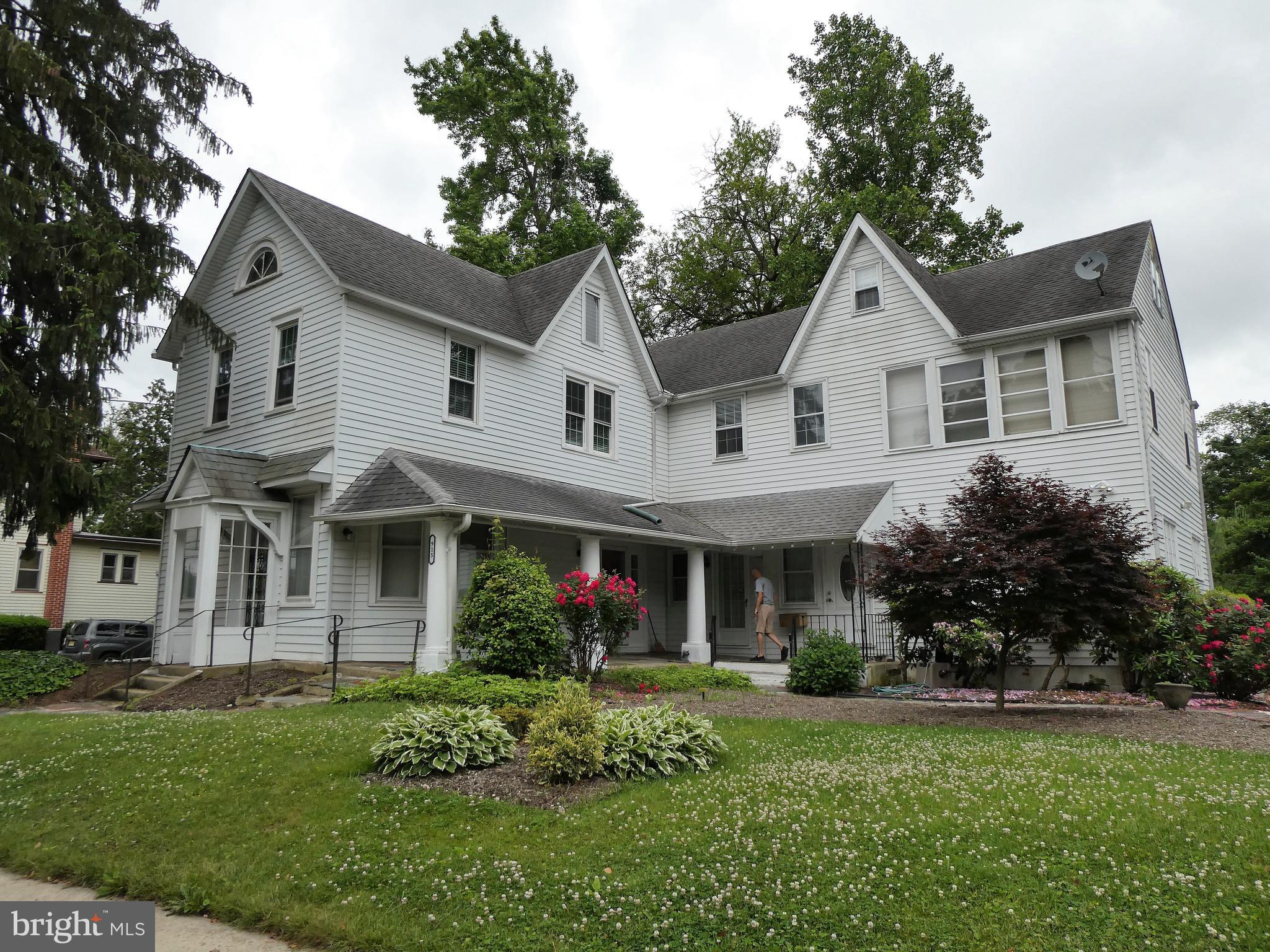 915 Stone Road Laurel Springs, NJ 08021 - Photo 1 of 30 a front view of a house with a yard and garage