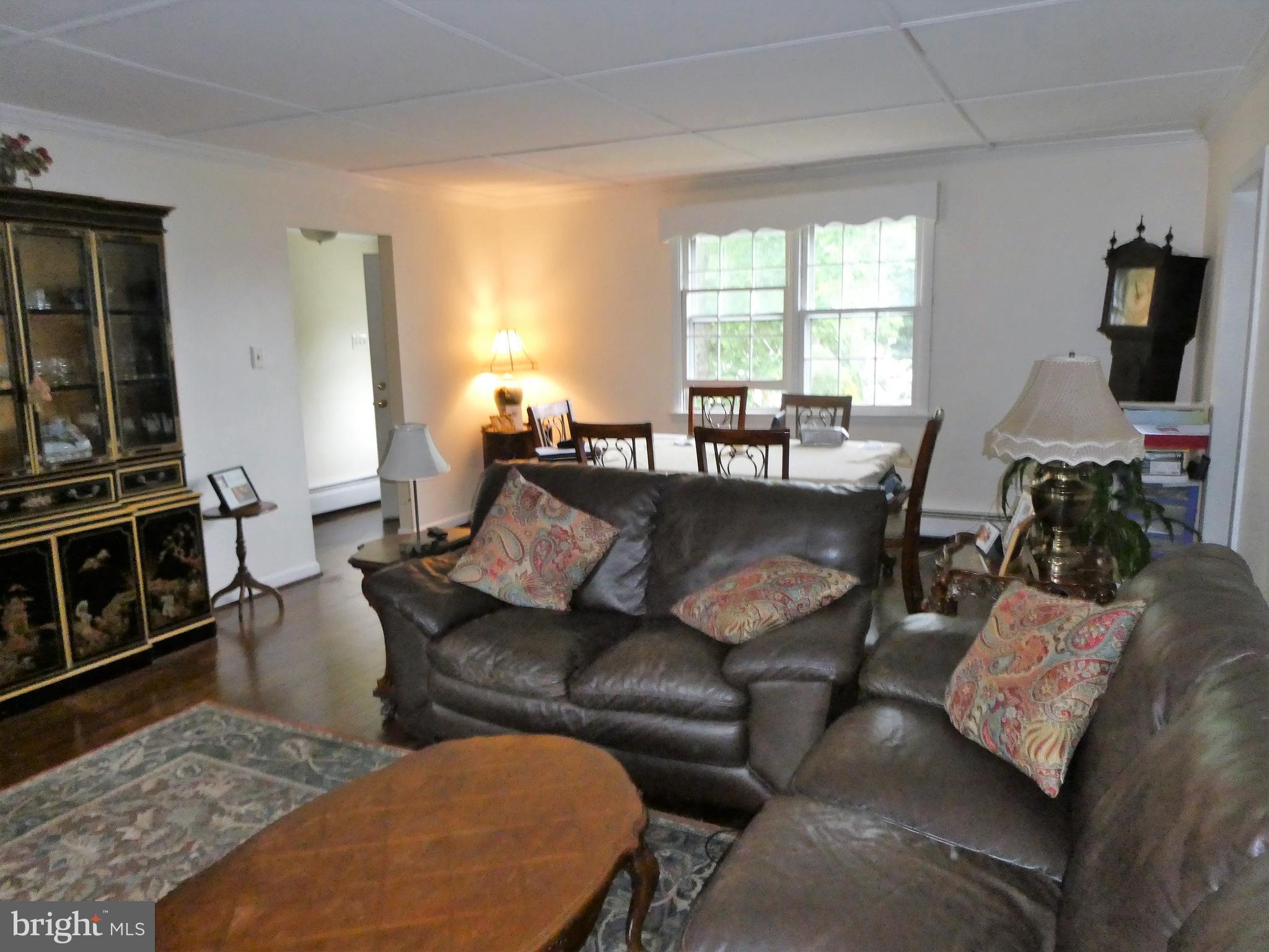 915 Stone Road Laurel Springs, NJ 08021 - Photo 2 of 30 a living room with furniture and a flat screen tv