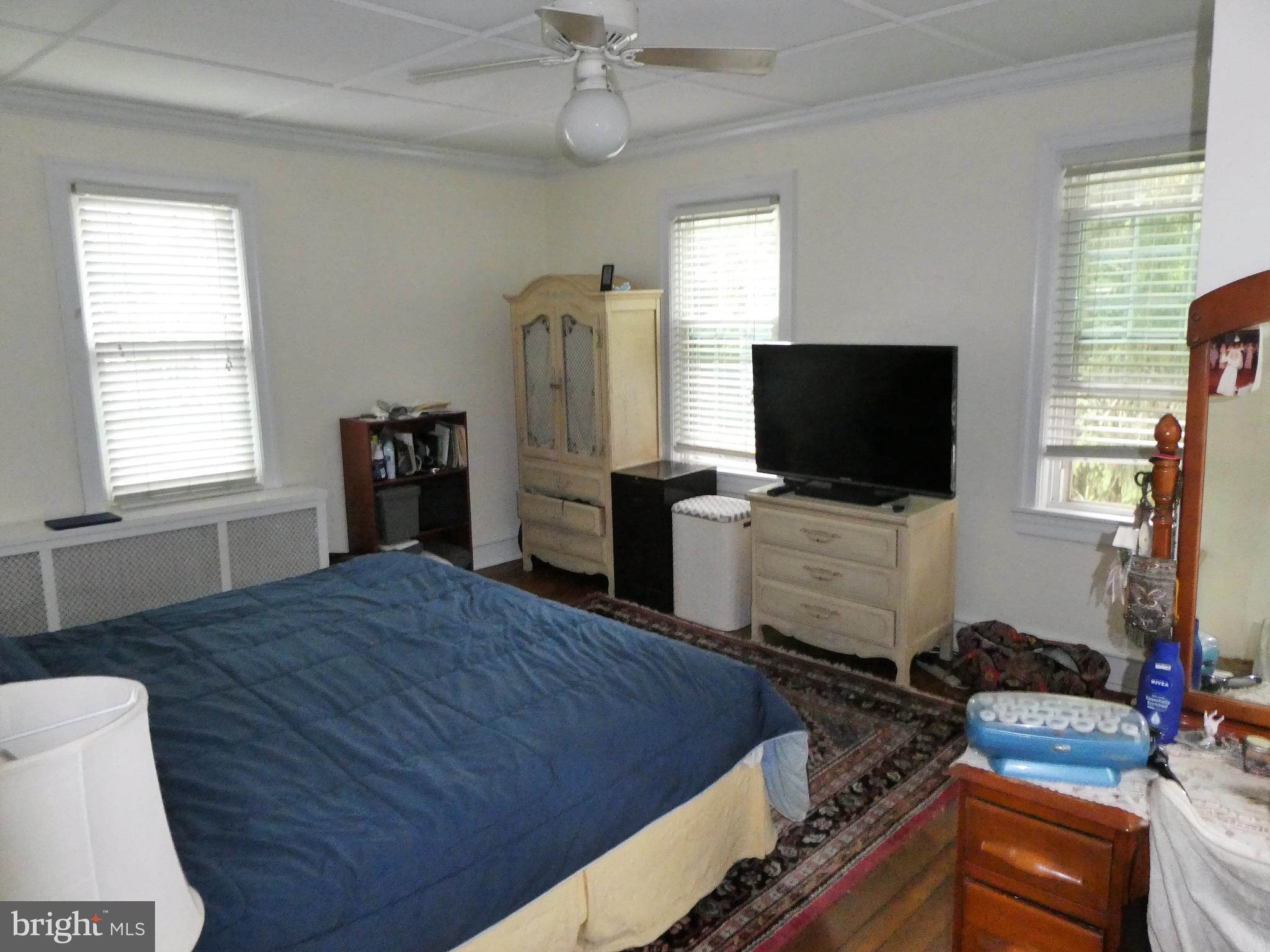 915 Stone Road Laurel Springs, NJ 08021 - Photo 23 of 30 a bedroom with a bed and a flat screen tv