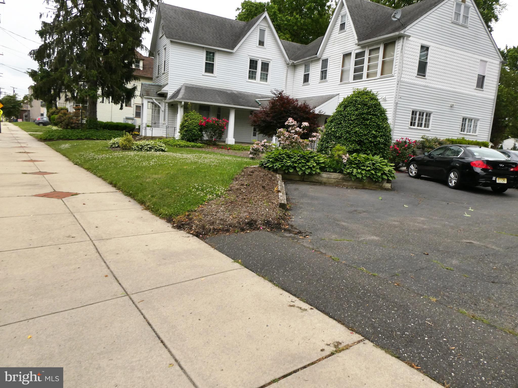 915 Stone Road Laurel Springs, NJ 08021 - Photo 26 of 30 a front view of a building with cars parked