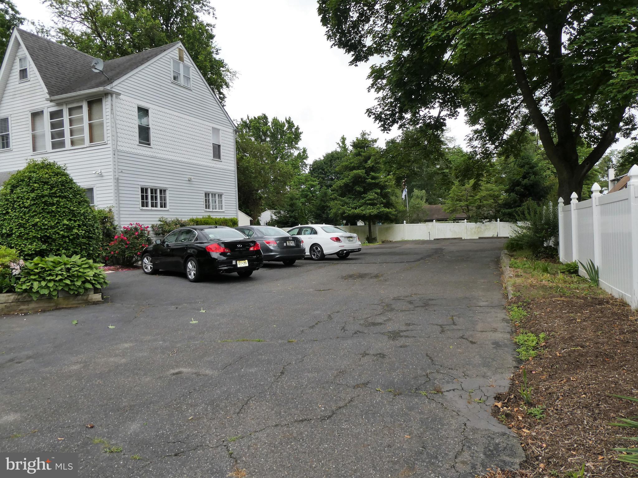 915 Stone Road Laurel Springs, NJ 08021 - Photo 27 of 30 a car parked in front of white house