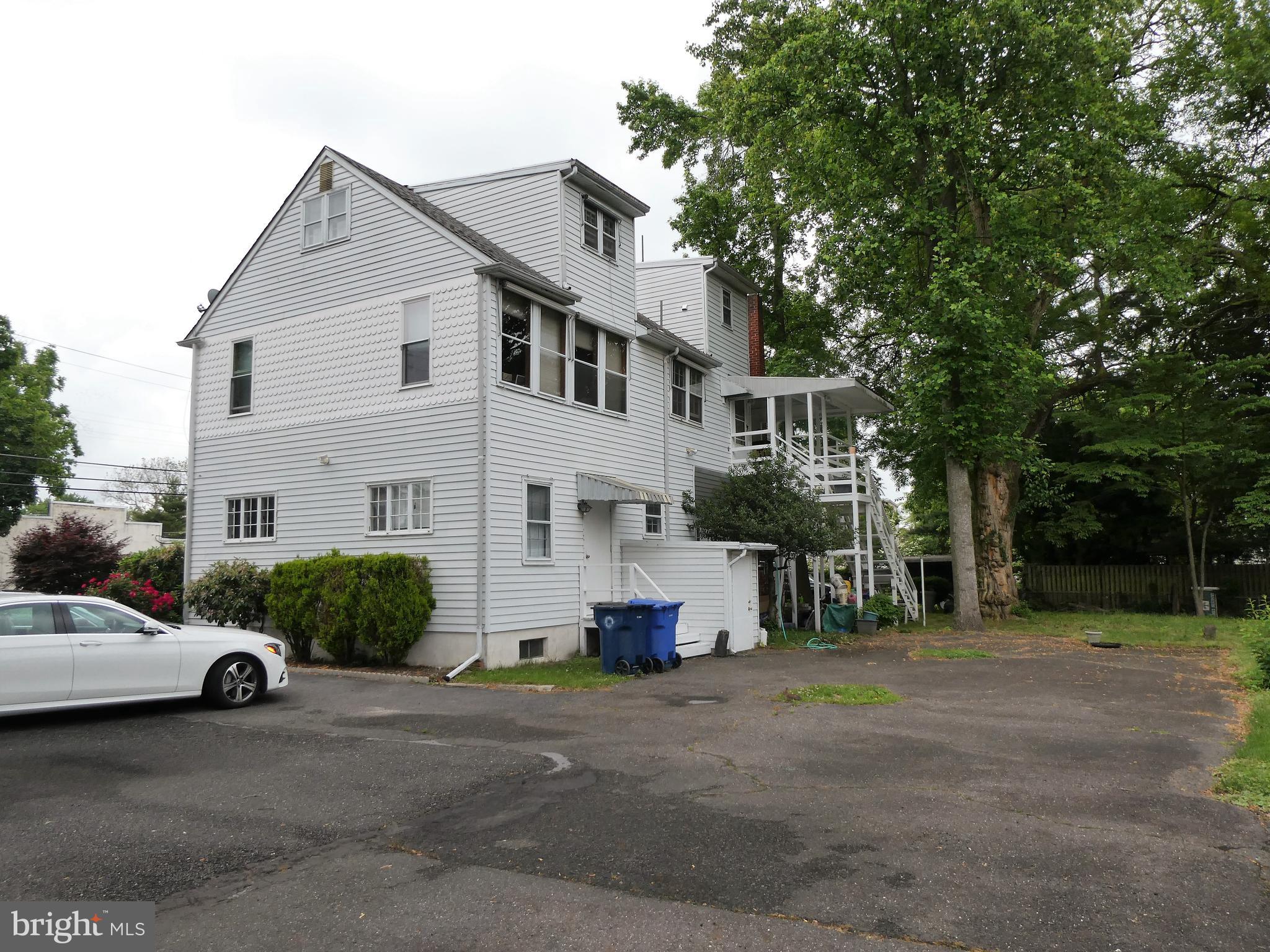 915 Stone Road Laurel Springs, NJ 08021 - Photo 28 of 30 a view of a white house and a car parked in front of a house