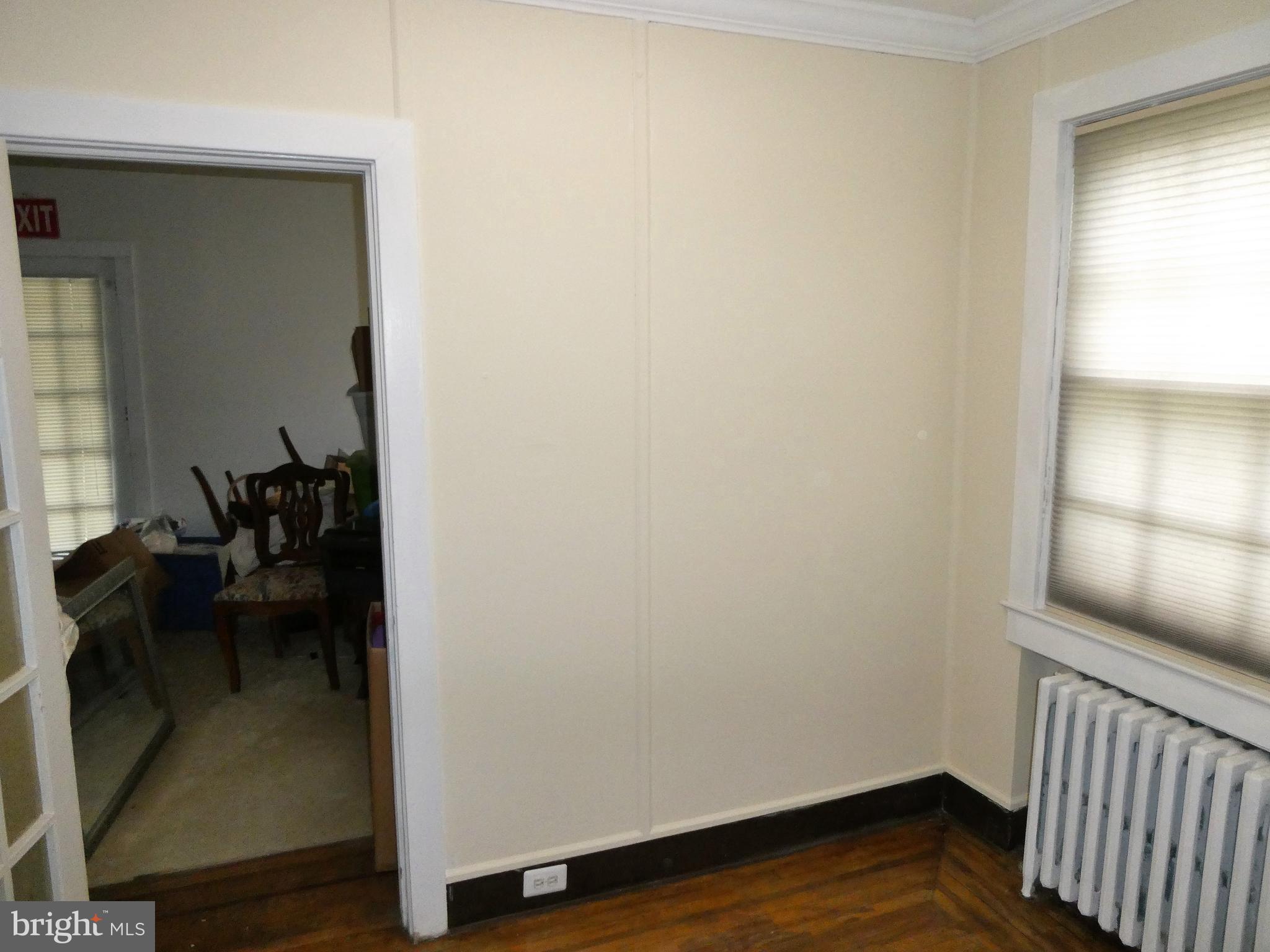 915 Stone Road Laurel Springs, NJ 08021 - Photo 6 of 30 a view of a hallway with wooden floor and a bedroom