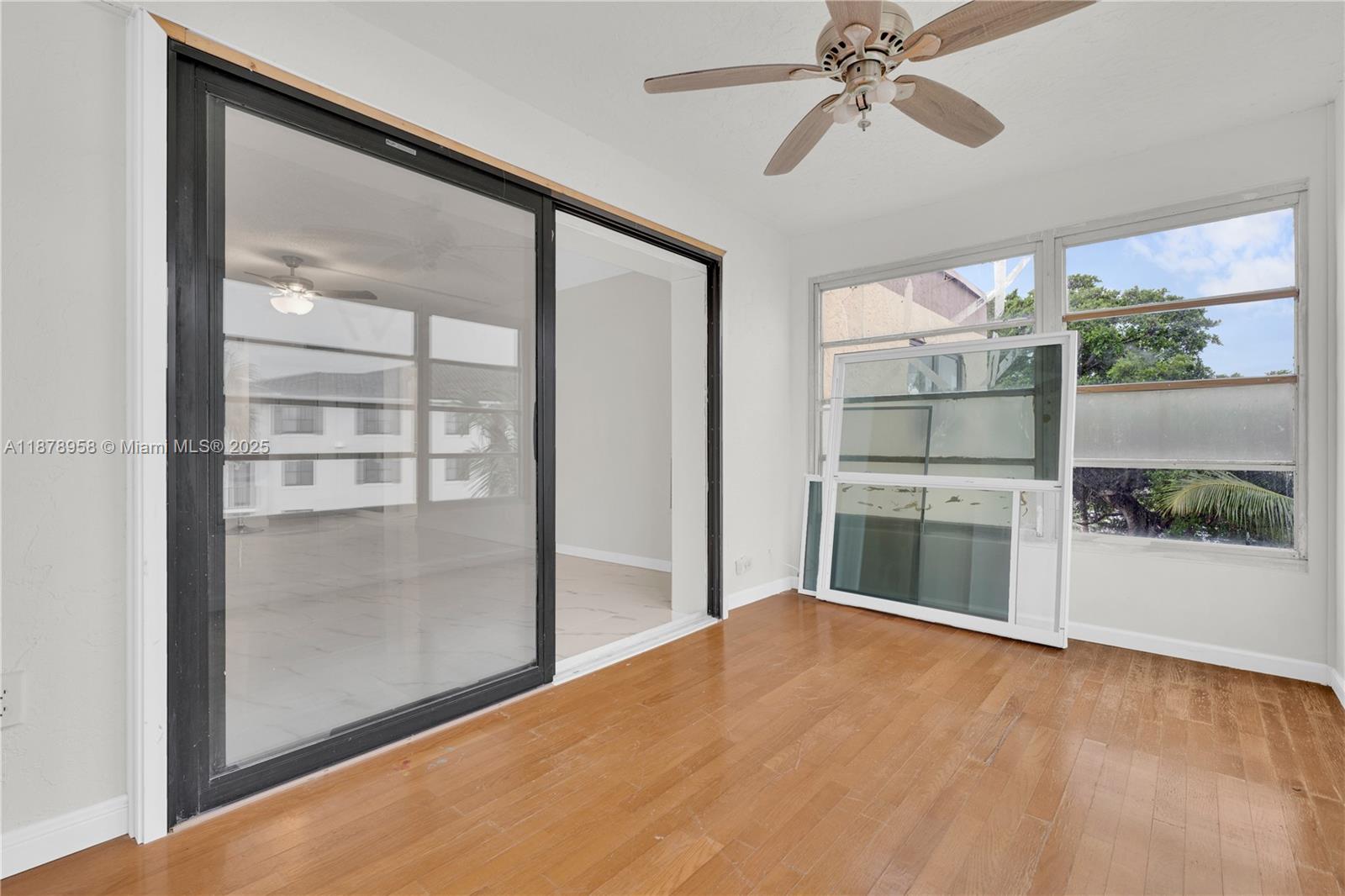 9355 Southwest 8th Street, Unit 425 Boca Raton, FL 33428 - Photo 11 of 42 a view of empty room with a ceiling fan and window