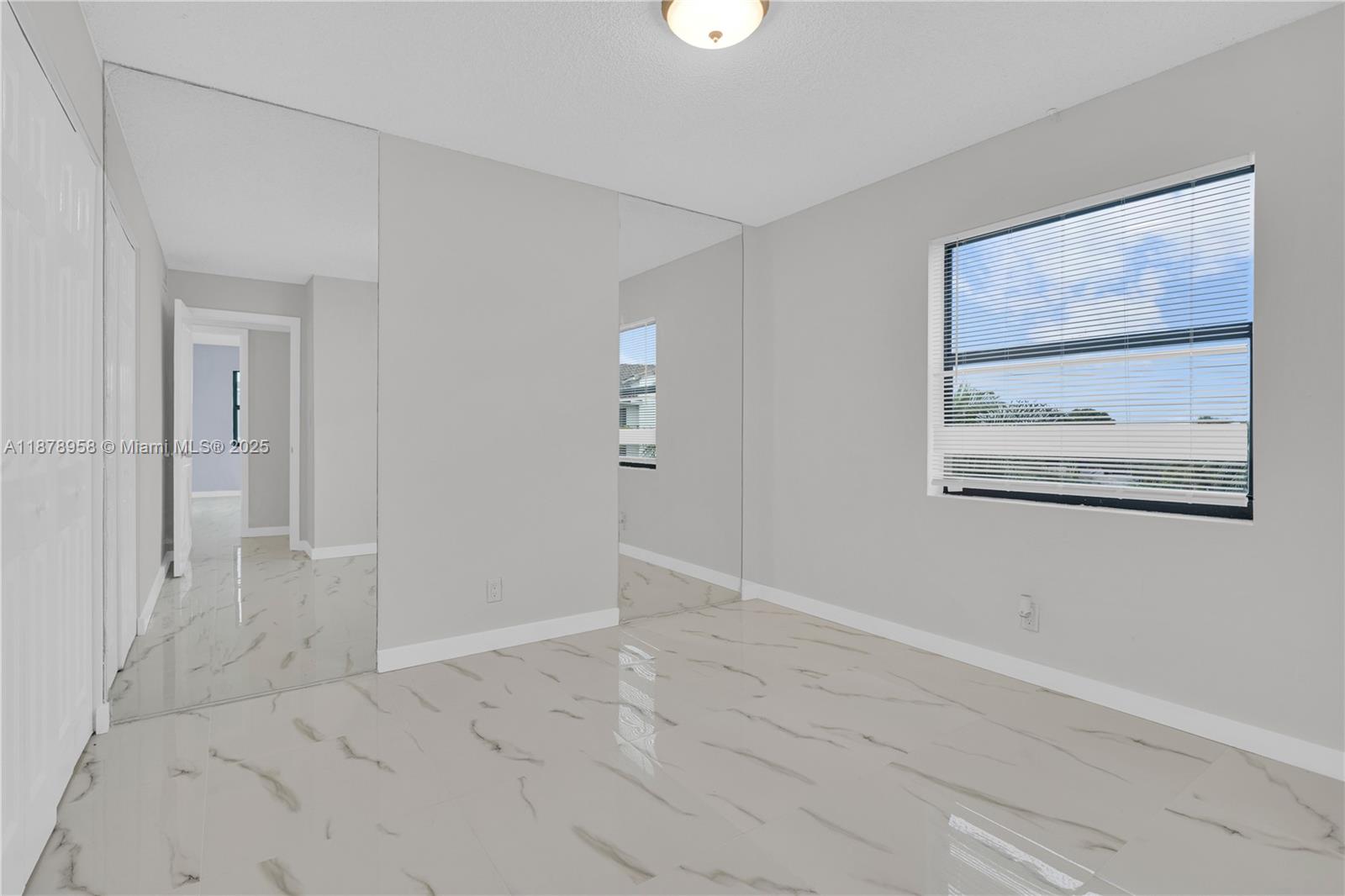 9355 Southwest 8th Street, Unit 425 Boca Raton, FL 33428 - Photo 14 of 42 wooden floor in a empty room