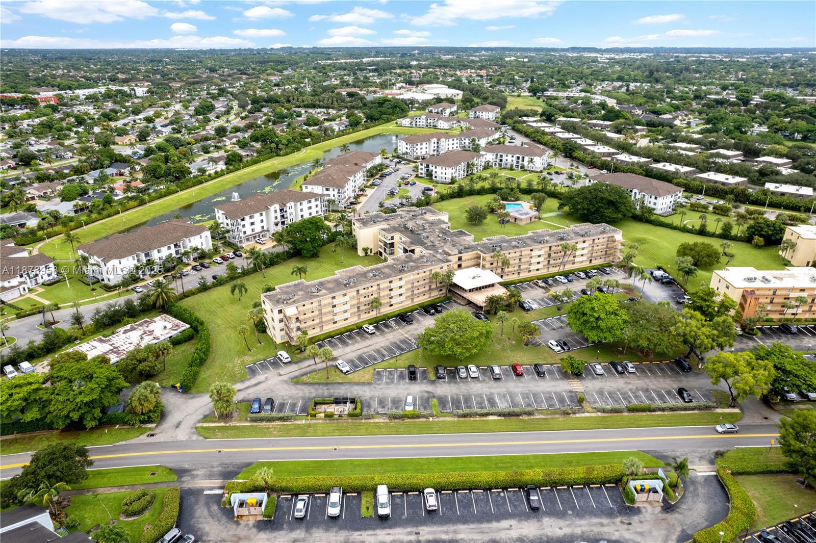 9355 Southwest 8th Street, Unit 425 Boca Raton, FL 33428 - Photo 38 of 42 an aerial view of a city with lots of residential buildings lake and mountain view in back