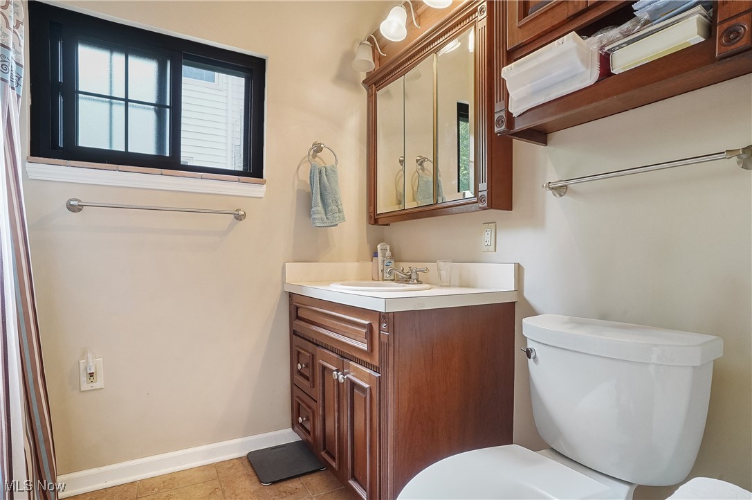 2829 Lee Road Silver Lake, OH 44224 - Photo 11 of 30 Bathroom with a wealth of natural light, toilet, and tile patterned floors
