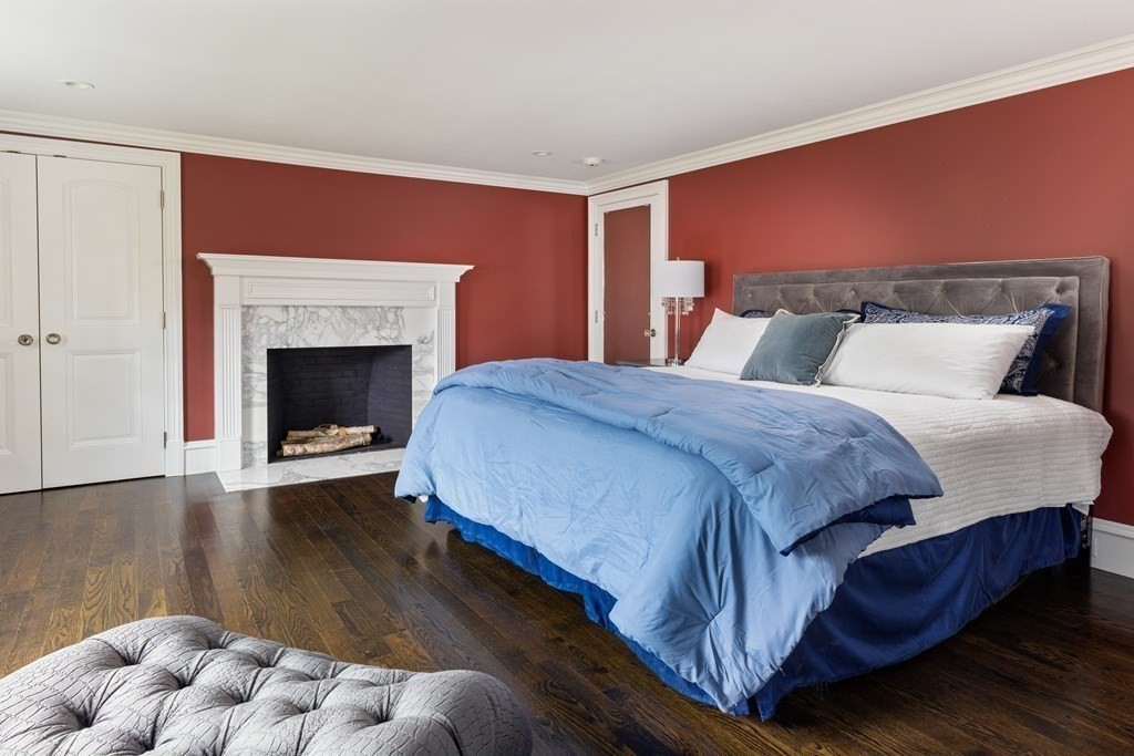 32 Parkman Way Needham, MA 02492 - Photo 21 of 35 a spacious bedroom with a bed and a fireplace