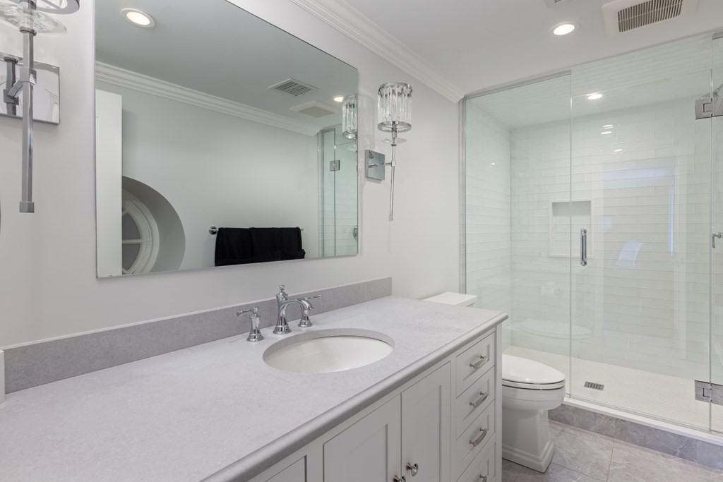 32 Parkman Way Needham, MA 02492 - Photo 22 of 35 a bathroom with a sink a toilet and shower