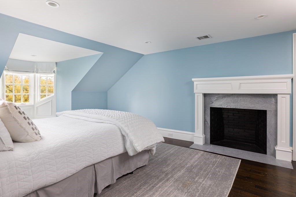 32 Parkman Way Needham, MA 02492 - Photo 23 of 35 a bedroom with a bed and a fireplace