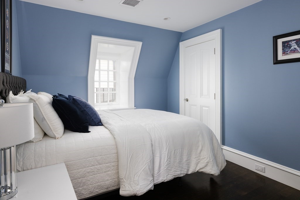 32 Parkman Way Needham, MA 02492 - Photo 25 of 35 a bedroom with a bed and wooden floor