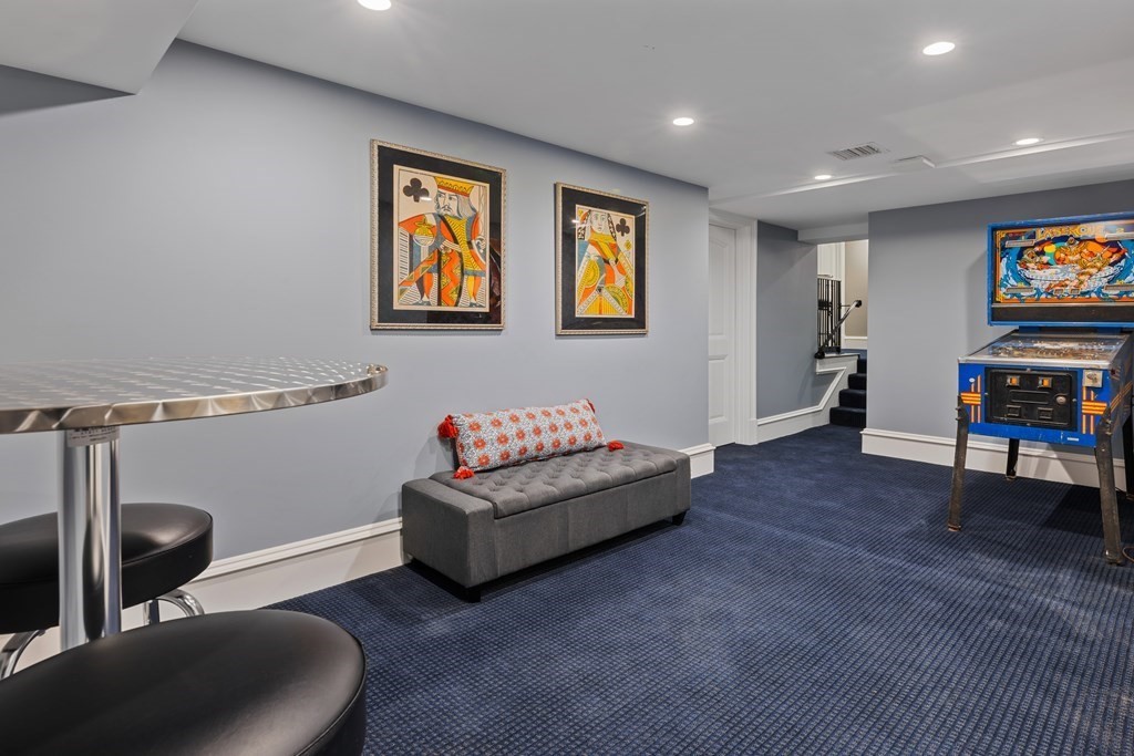 32 Parkman Way Needham, MA 02492 - Photo 30 of 35 a living room with furniture and a flat screen tv
