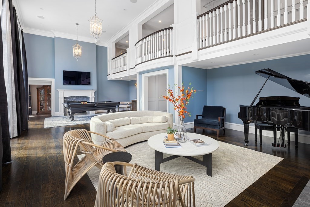 32 Parkman Way Needham, MA 02492 - Photo 5 of 35 a living room with furniture a dining table and kitchen view