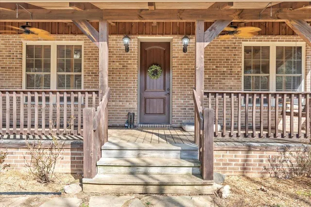 a view of a balcony with wooden floor