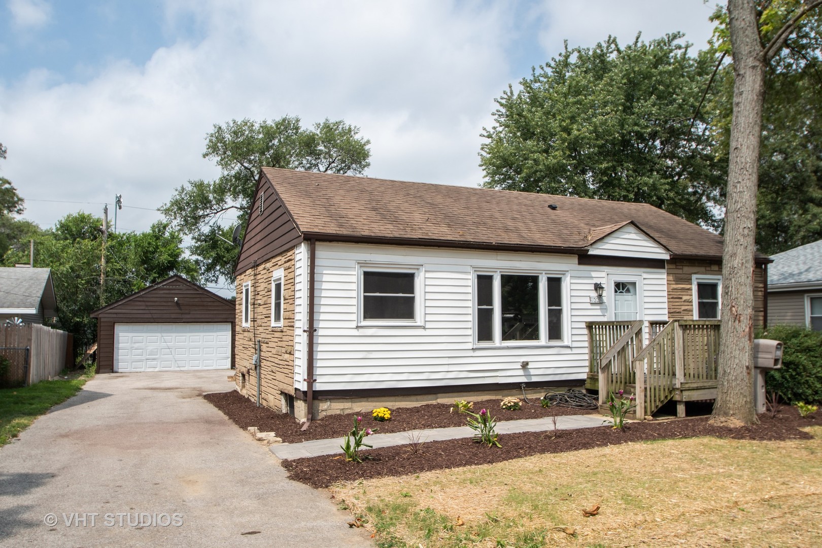 1225 Cleveland Street Lockport, IL 60441 - Photo 1 of 17 a view of a house with a yard and large tree