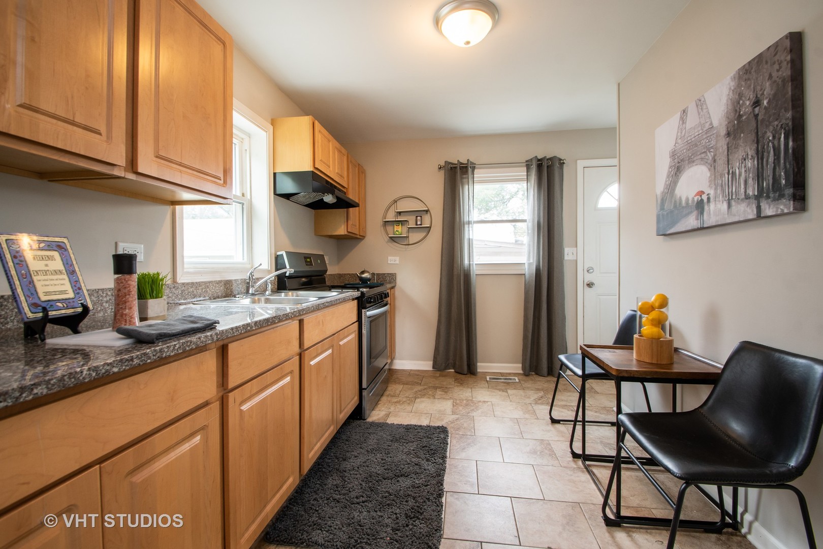 1225 Cleveland Street Lockport, IL 60441 - Photo 4 of 17 a kitchen with stainless steel appliances granite countertop a sink and cabinets