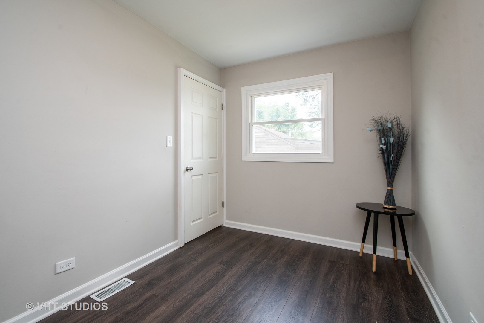 1225 Cleveland Street Lockport, IL 60441 - Photo 10 of 17 an empty room with wooden floor and a window