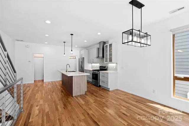 a kitchen with a stove and a sink
