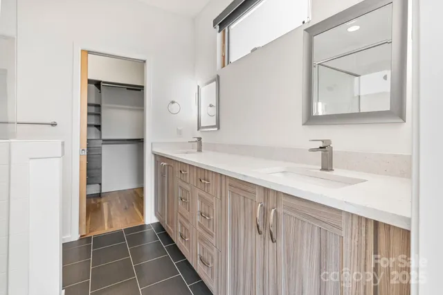 a bathroom with a glass shower door