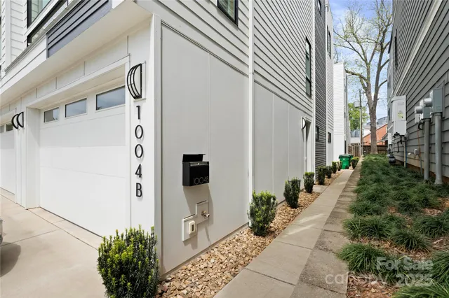 a view of a path along with potted plants