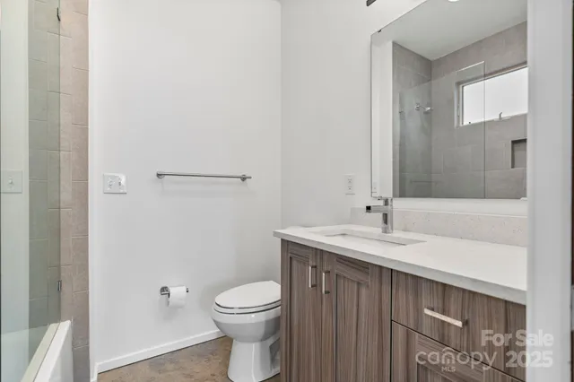 a bathroom with a bathtub and shower