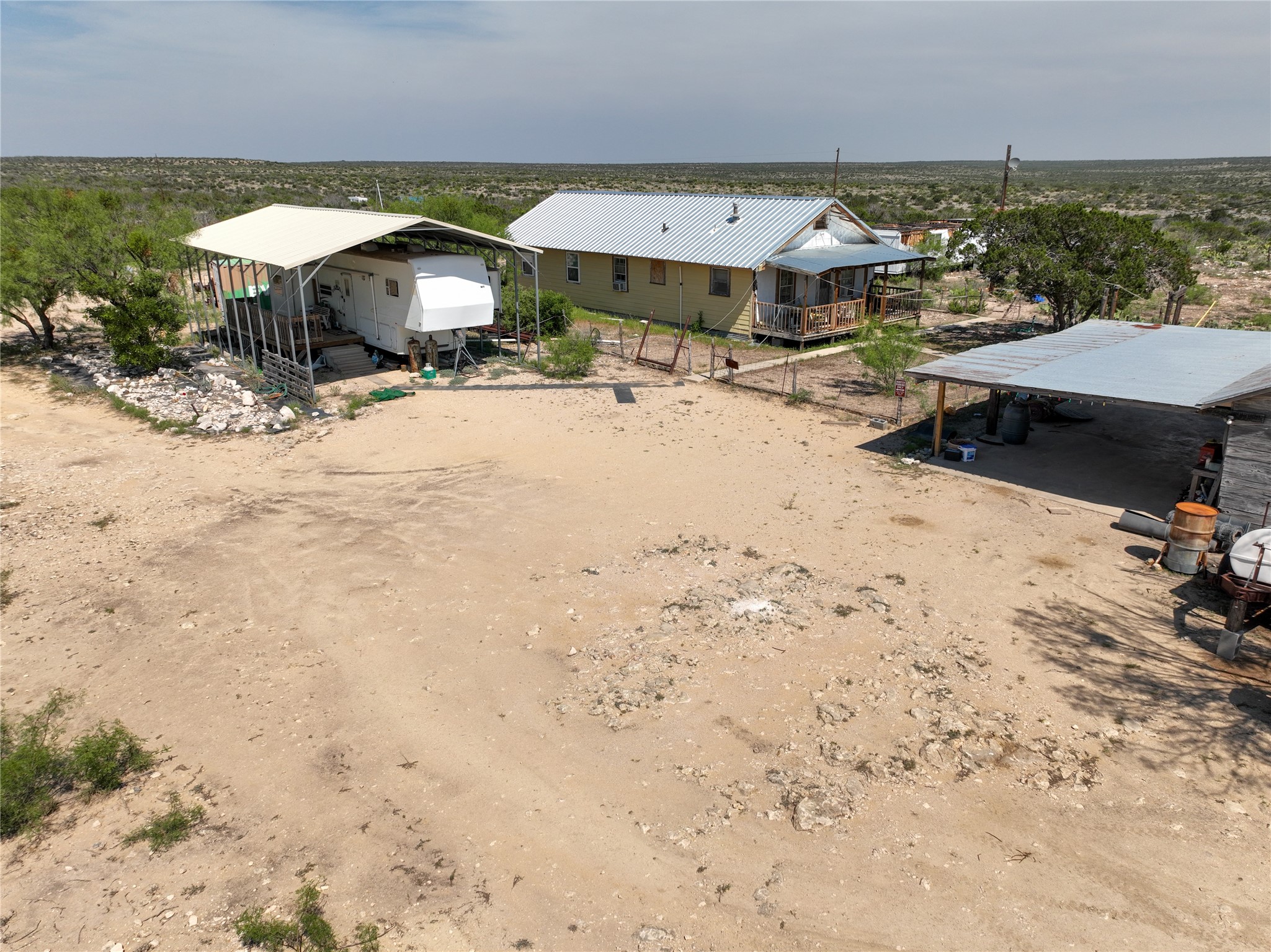 0 Rr 1024 Comstock, TX 78837 - Photo 7 of 50 a view of a terrace with a barbeque and wooden fence