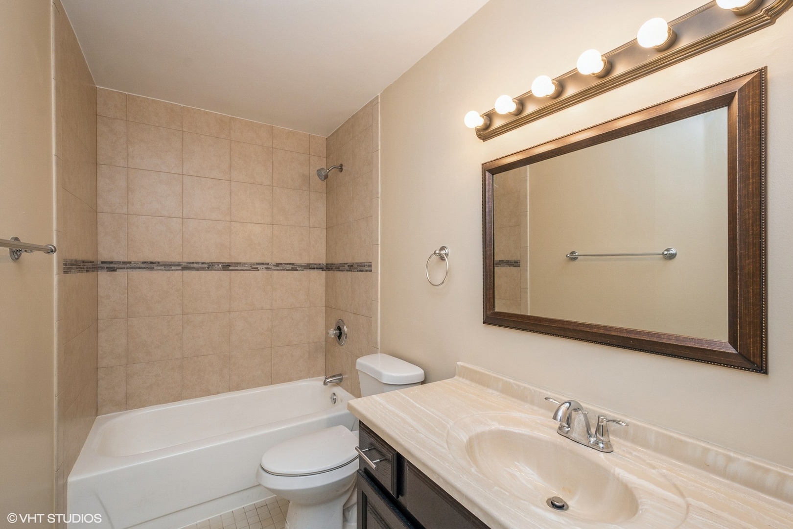 5320 North Sheridan Road, Unit 608 Chicago, IL 60640 - Photo 8 of 10 a bathroom with a sink toilet and shower