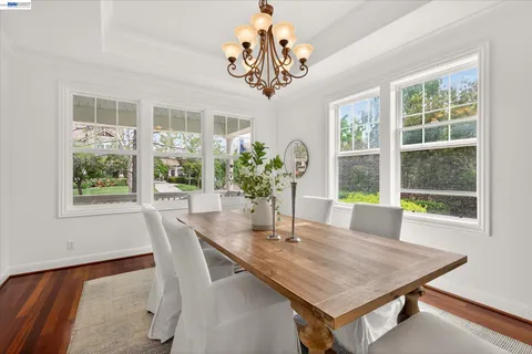 a dining room with furniture and window