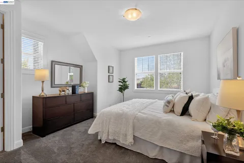a bedroom with a bed and window