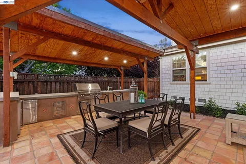a view of an outdoor space with a table and chairs
